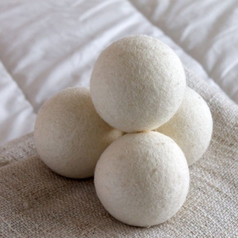Laundry dryer balls in a stack on some cloth