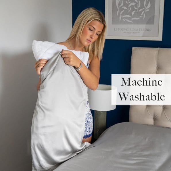 Young woman applying the light grey pillow case to her pillow