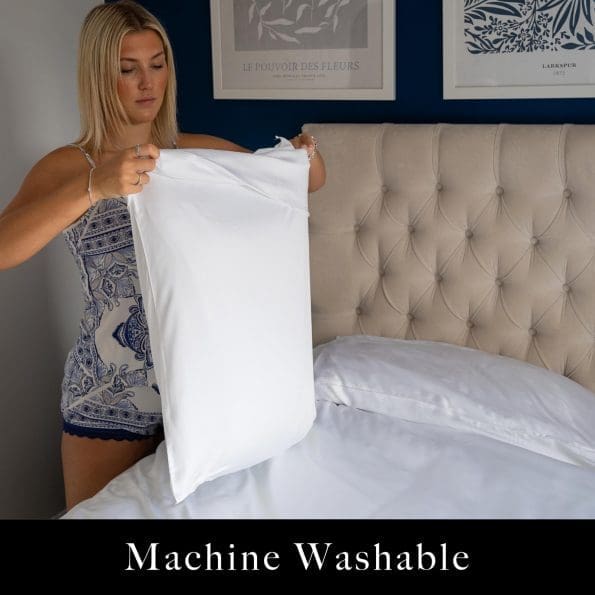 Woman putting her pillow in a white bamboo fabric pillow case