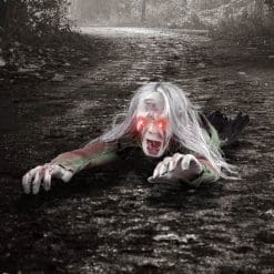 crawling zombie with red glowing eyes and scary face paint